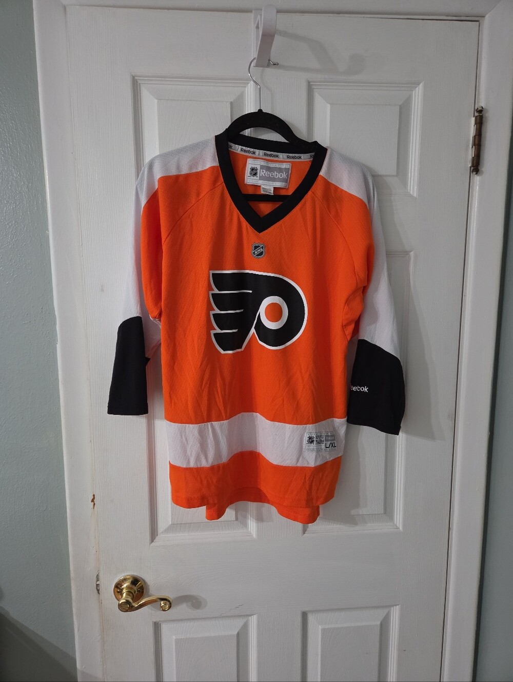 Reebok NHL OFFICIAL Kids Philadelphia Flyers Orange Hockey Jersey. L/XL